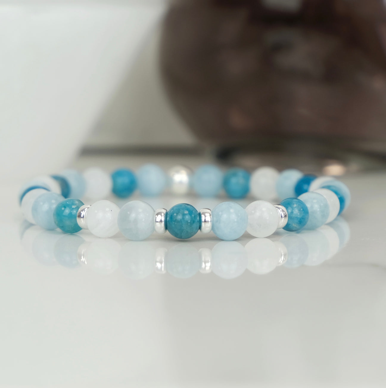 An Apatite, Moonstone and Aquamarine gemstone bracelet with 925 sterling silver accessories