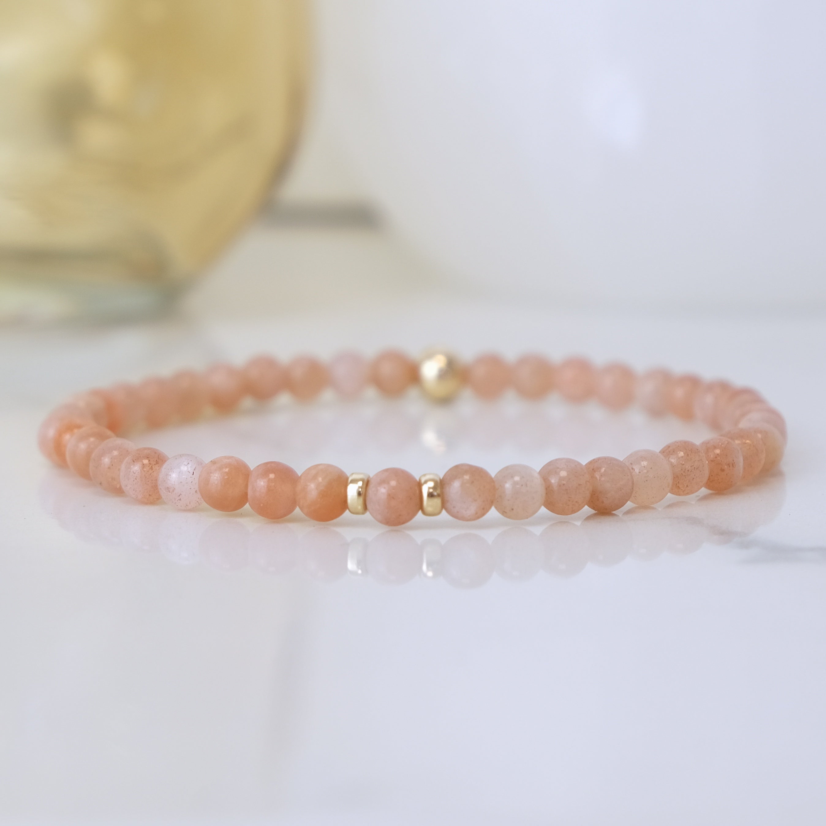 Sunstone gemstone bracelet in 4mm beads with Gold accents 