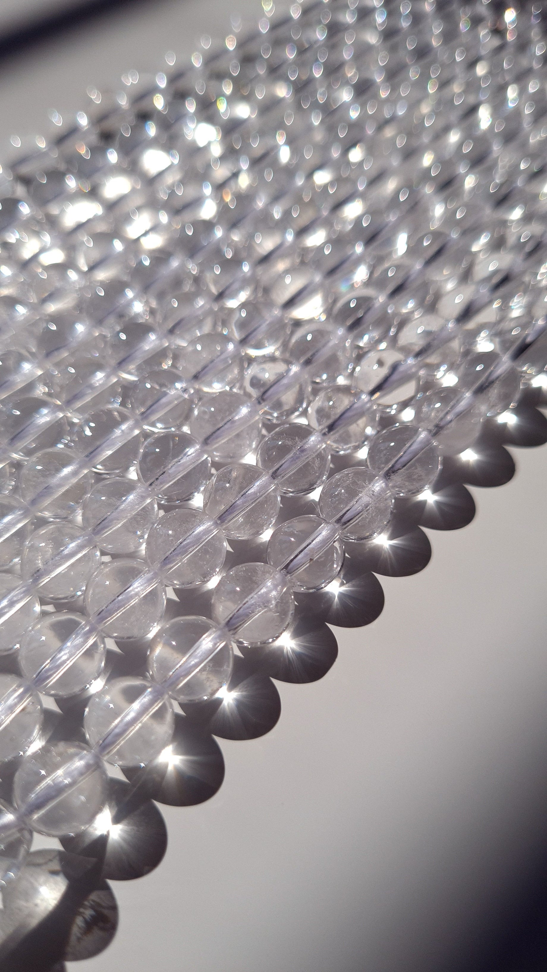 Strings of clear quartz semi-precious gemstone beads