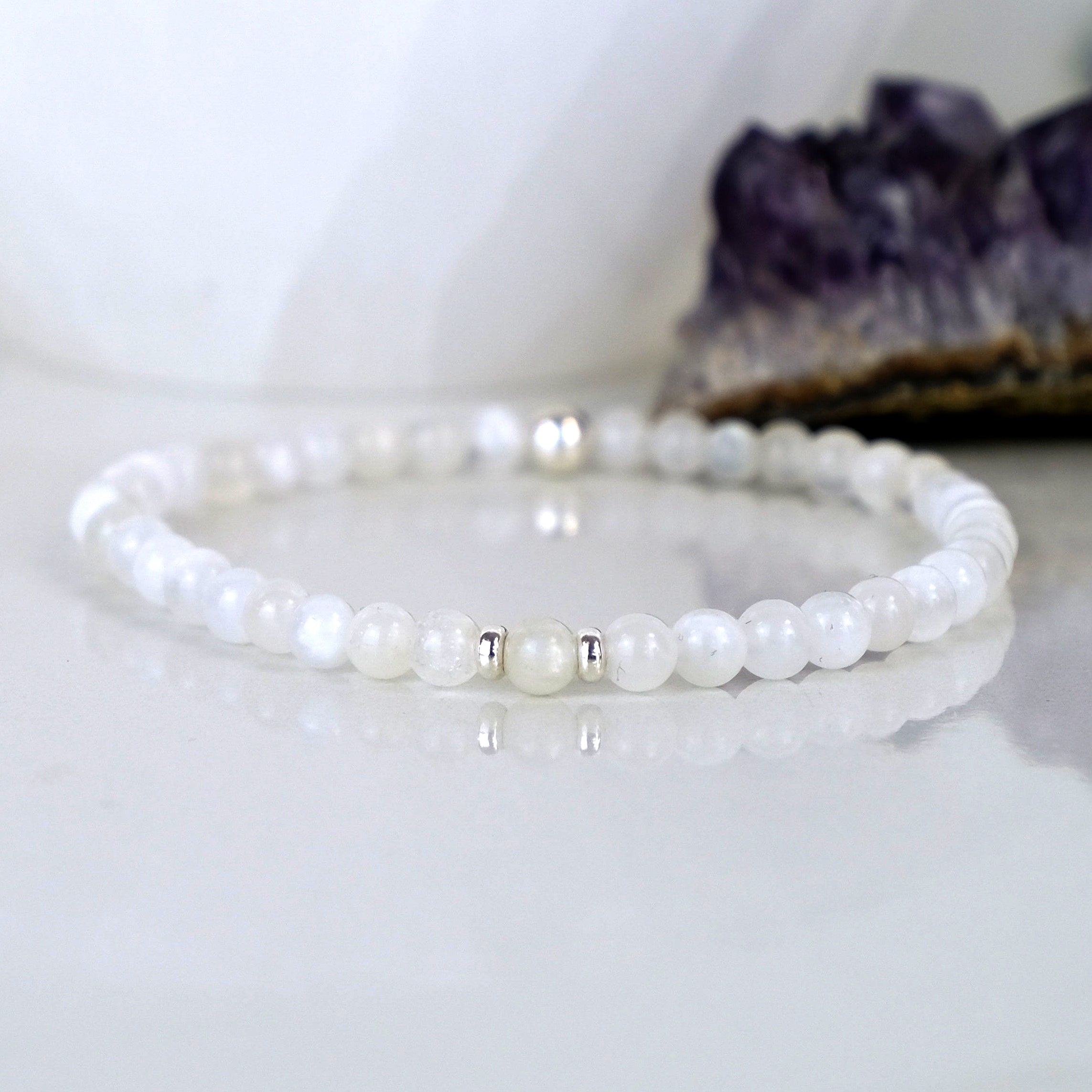 A moonstone gemstone bracelet in 4mm beads with silver accessories