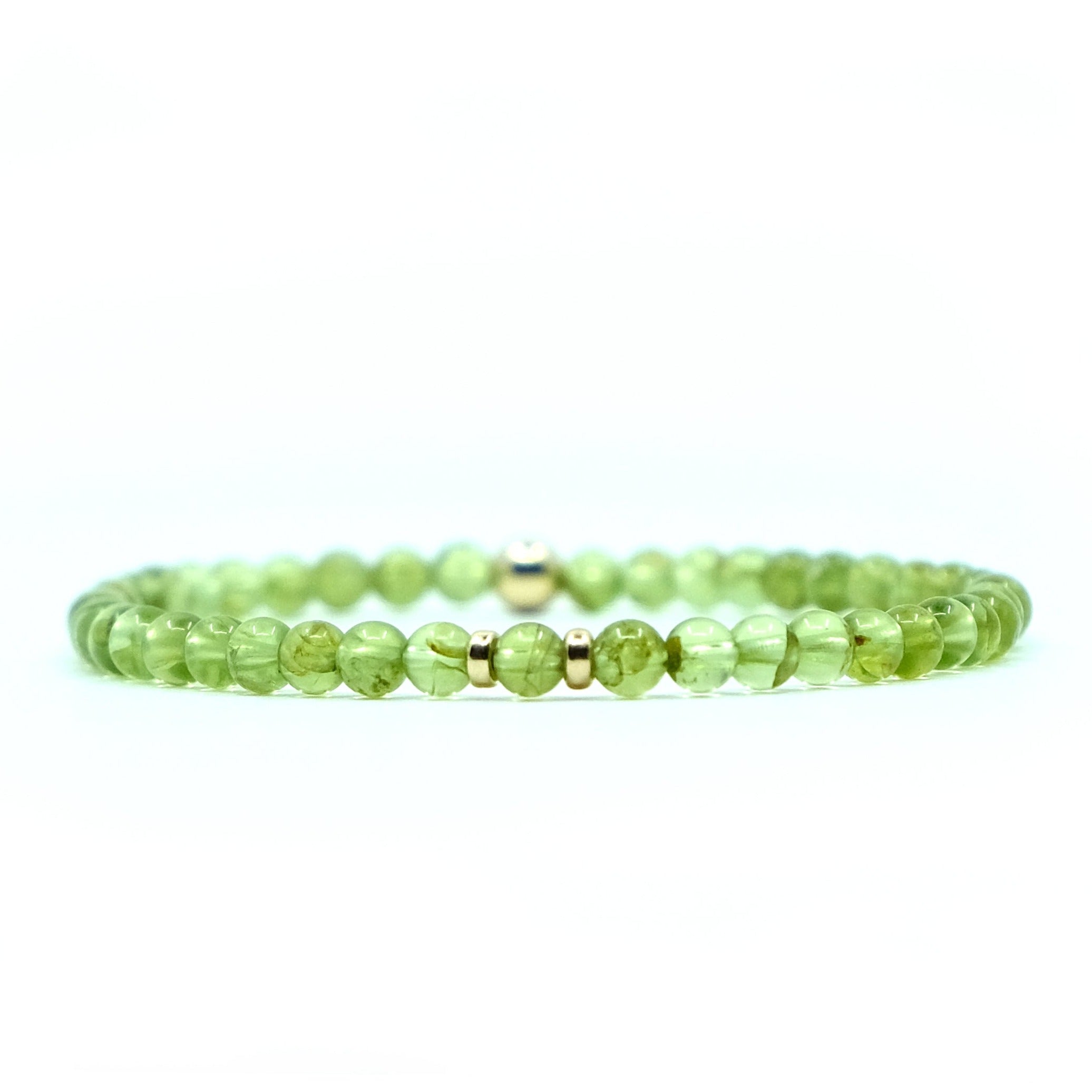 A 4mm peridot gemstone bracelet with gold filled accessories
