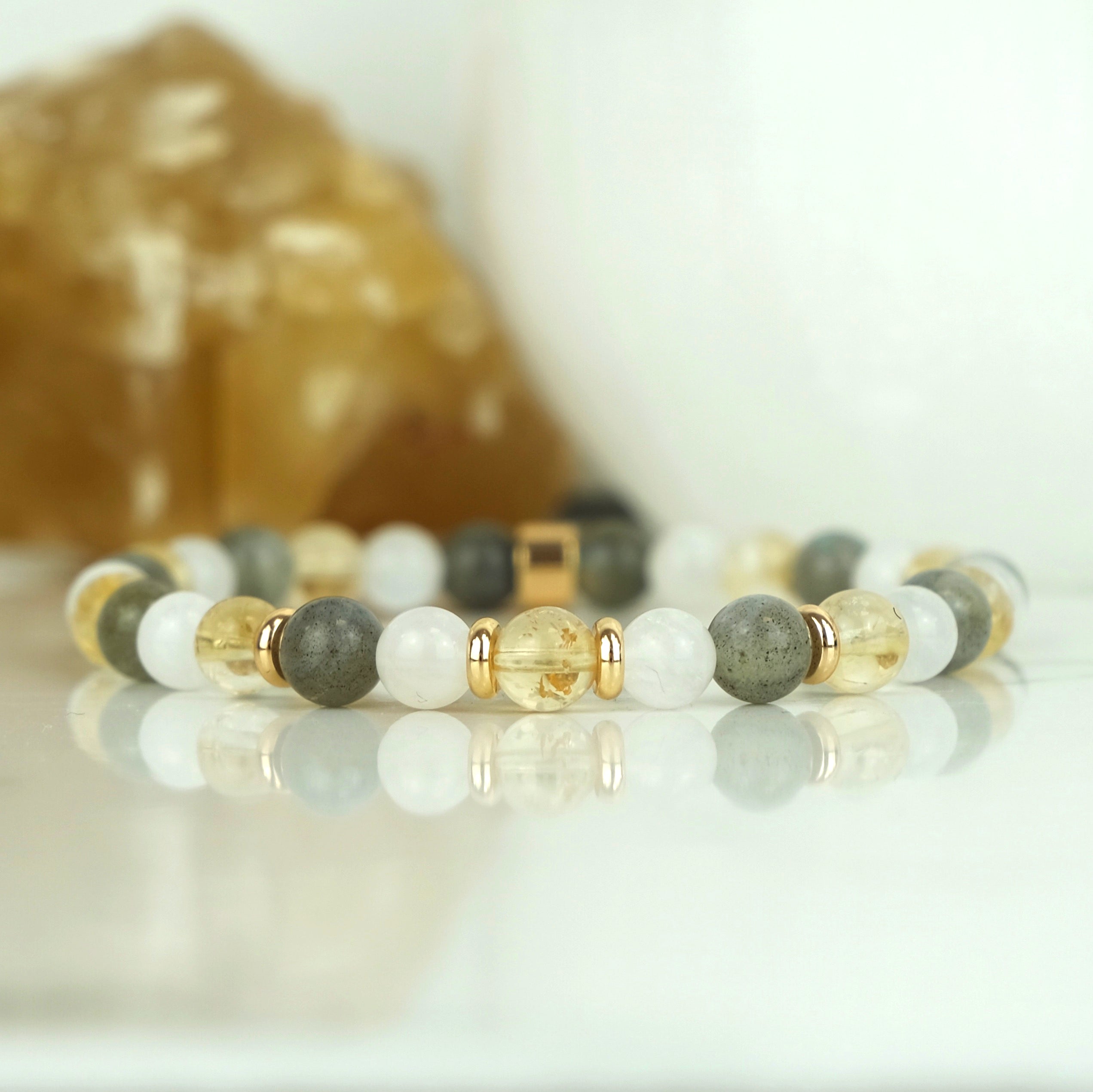 A citrine, labradorite and moonstone gemstone bracelet in 6mm beads with gold accessories