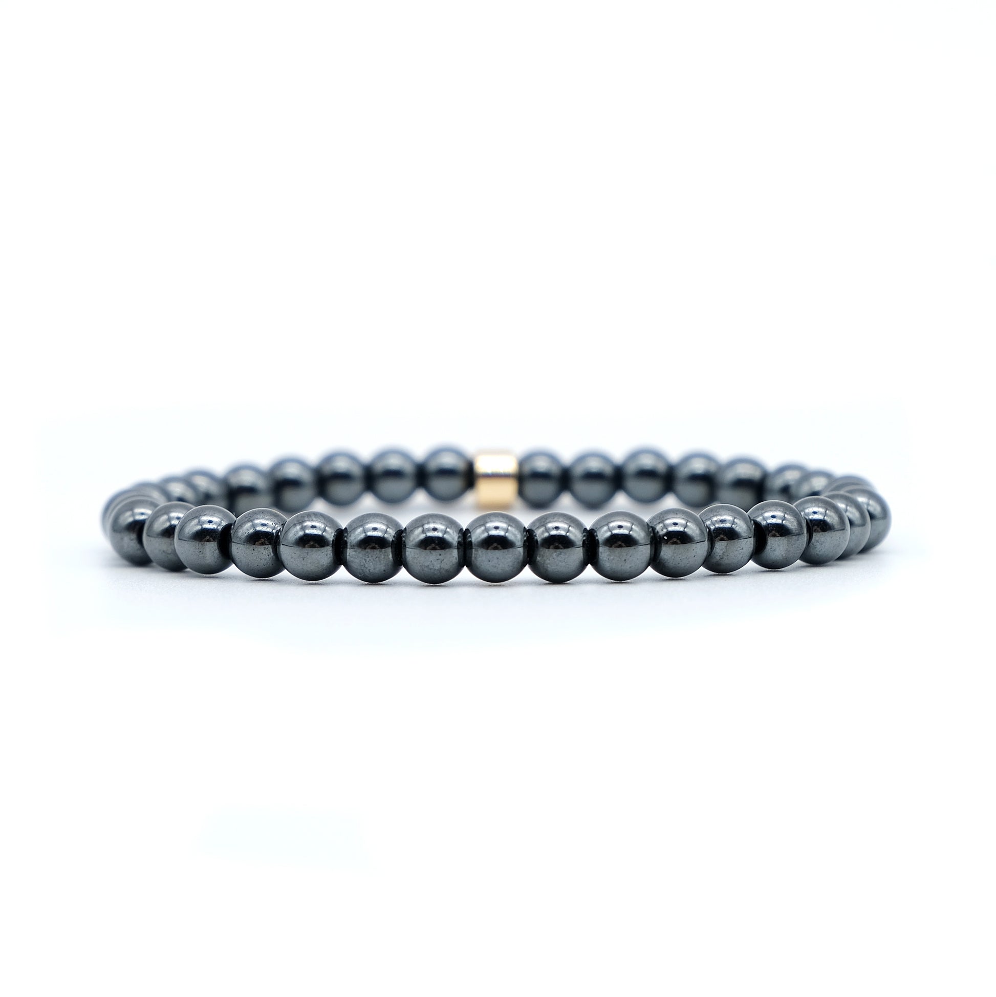 Hematite gemstone bracelet in 6mm beads with gold accessory