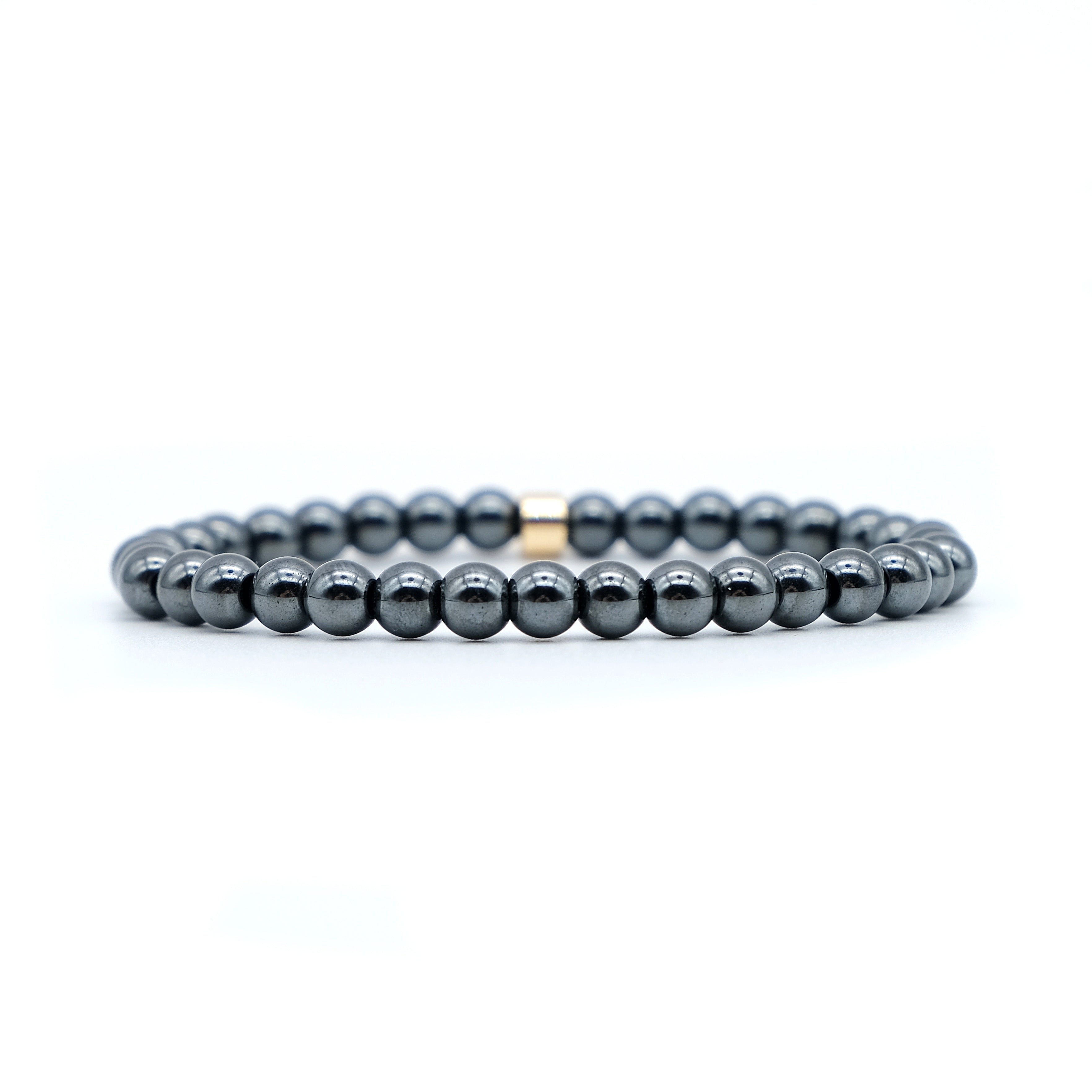 Hematite gemstone bracelet in 6mm beads with gold accessory