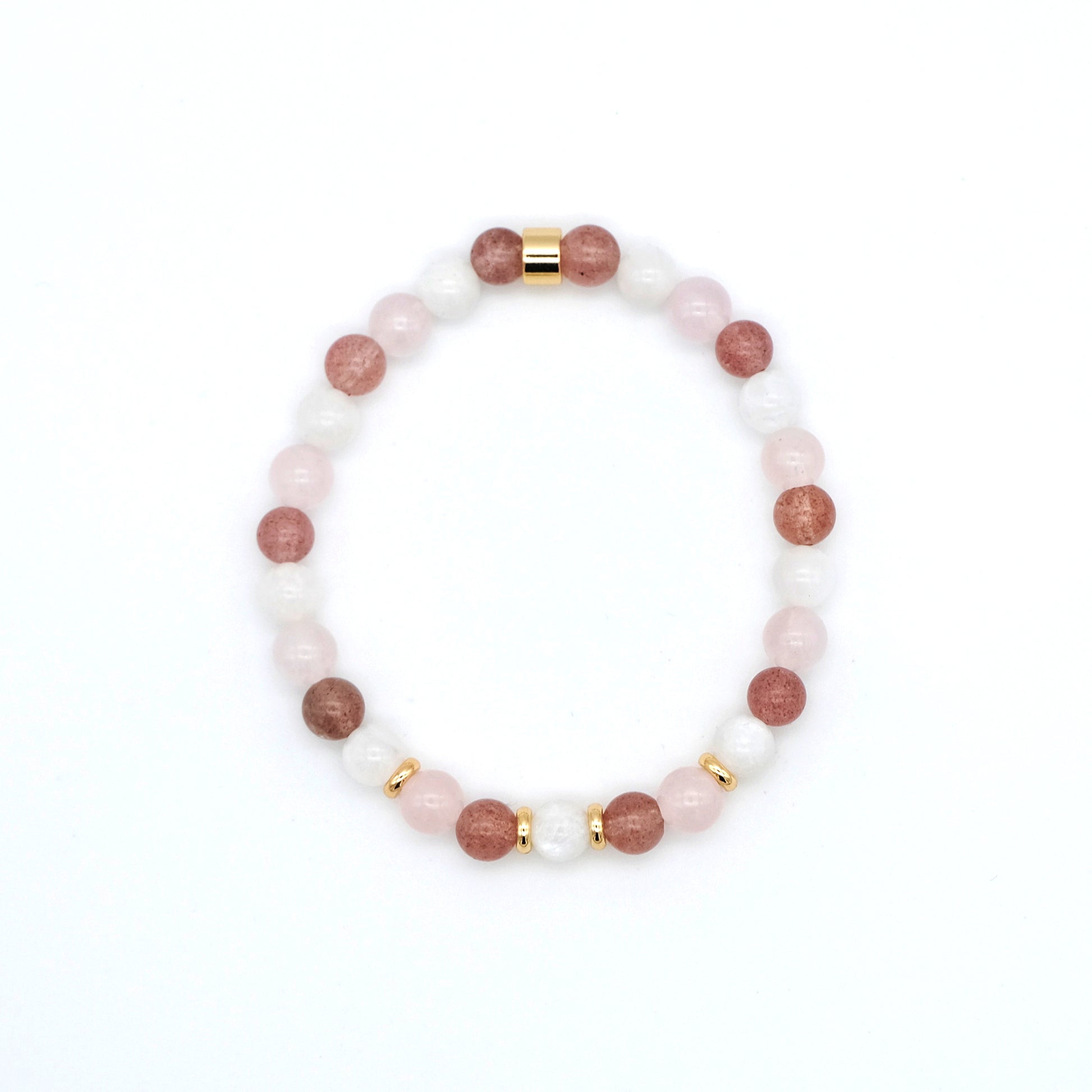 A moonstone, strawberry quartz and rose quartz gemstone bracelet in 6mm beads with gold accessories from above