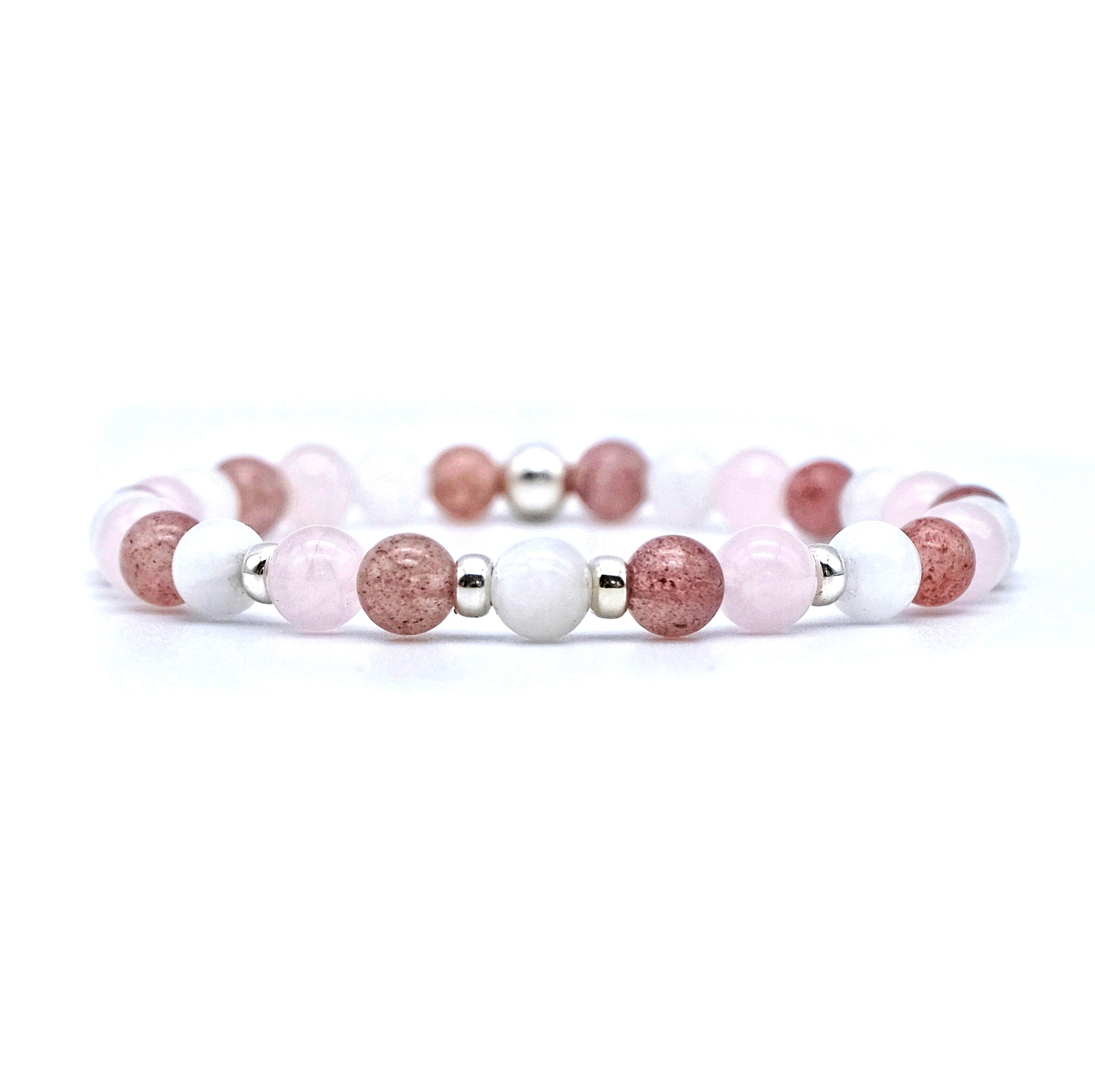 A moonstone, strawberry quartz and rose quartz gemstone bracelet in 6mm beads with silver accessories