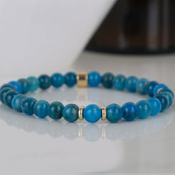 Apatite gemstone bracelet in 6mm with gold accessories