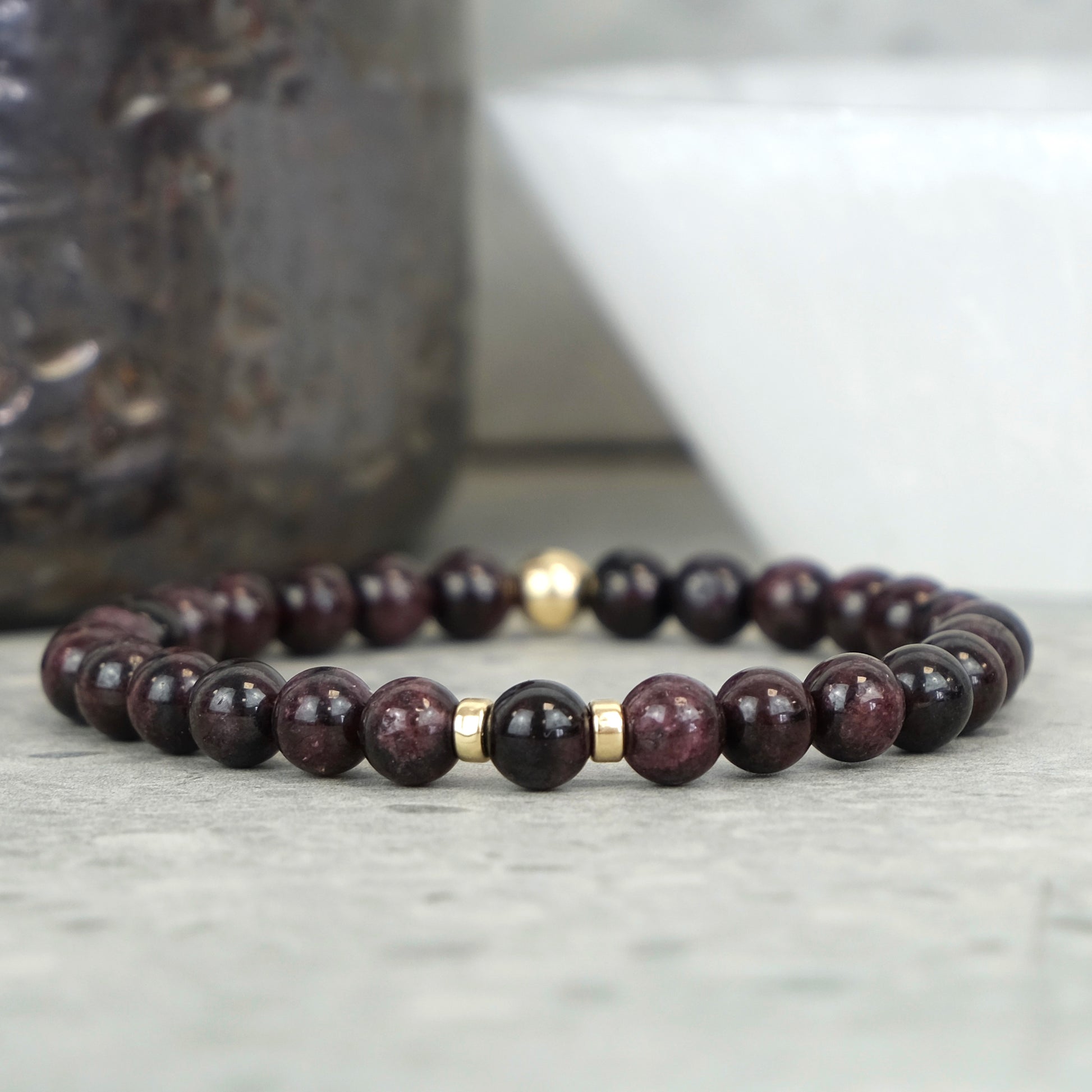 A garnet gemstone bracelet in 6mm beads with gold filled accessories