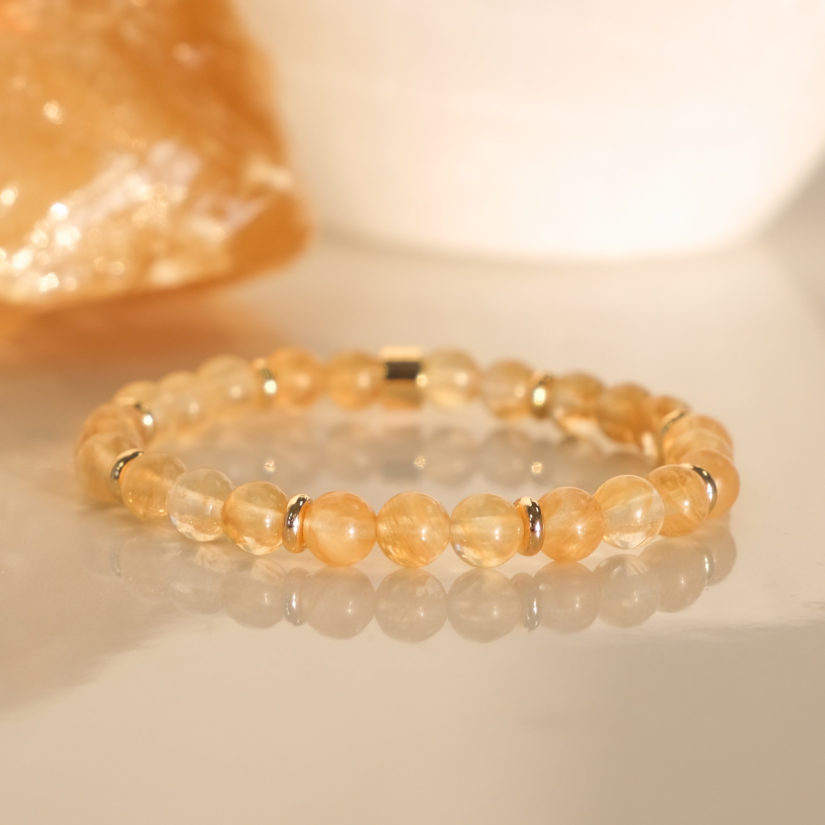 A golden healer quartz bracelet in 6mm with gold plated accessories