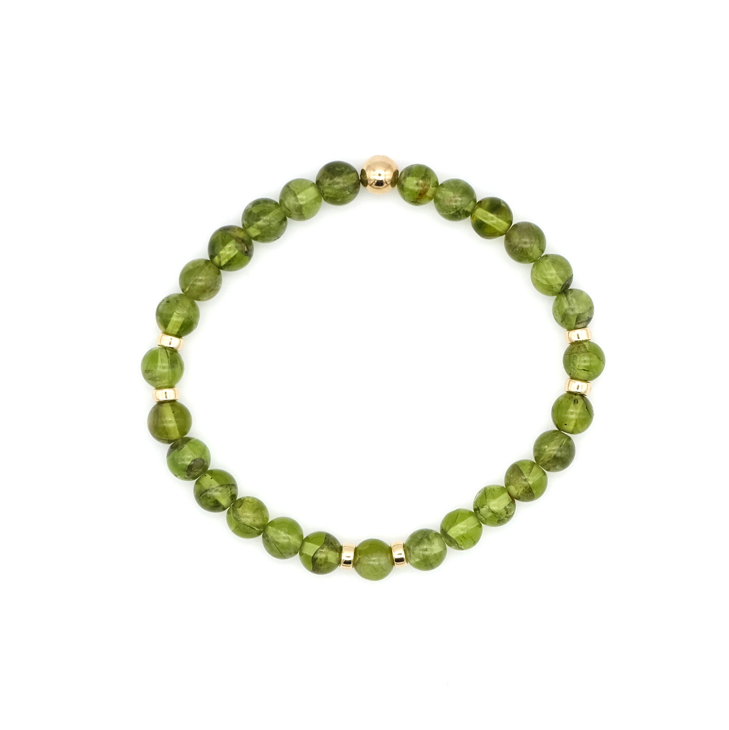 Peridot beaded gemstone healing bracelet with gold filled accessories from above 