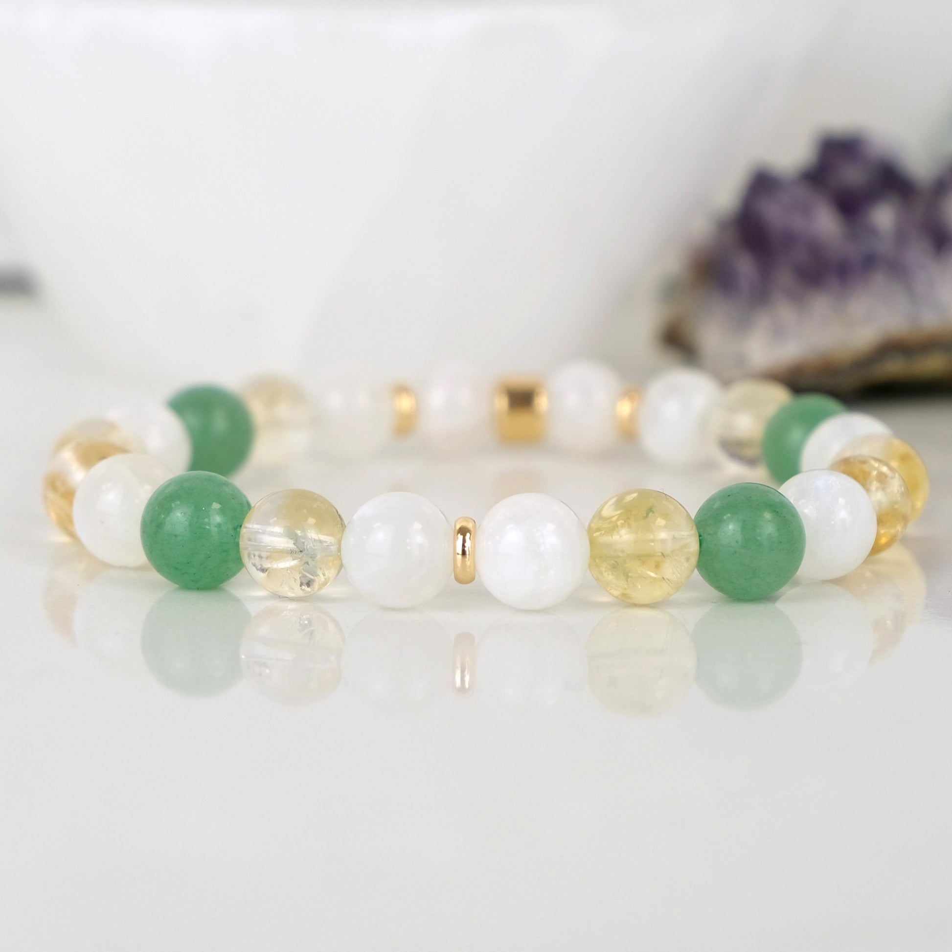 An aventurine, moonstone and citrine gemstone bracelet with gold accessories