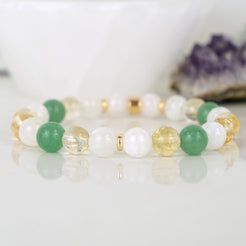 An aventurine, moonstone and citrine gemstone bracelet with gold accessories
