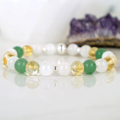 An aventurine, moonstone and citrine gemstone bracelet with silver accessories