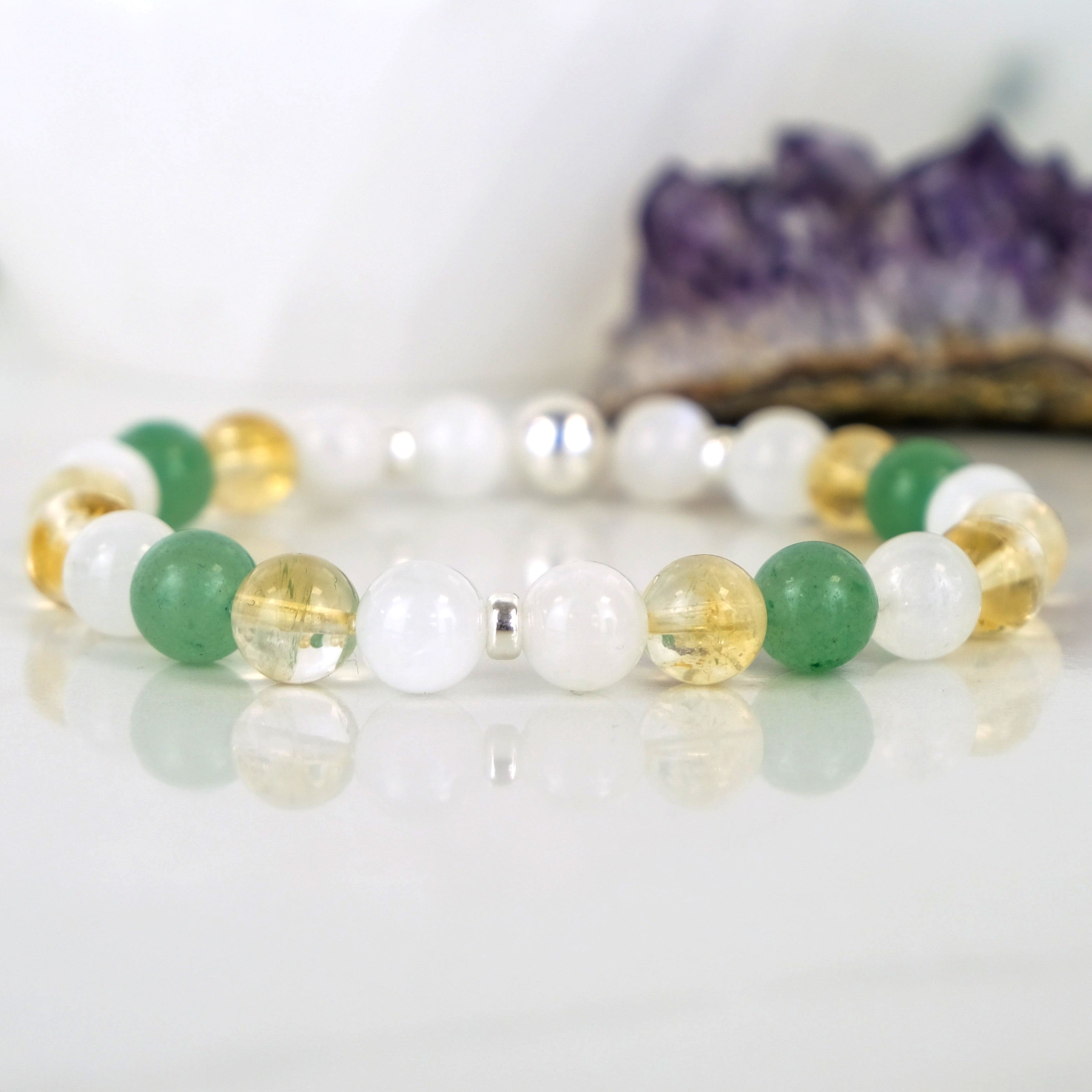 An aventurine, moonstone and citrine gemstone bracelet with silver accessories