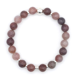 Lavender rose quartz gemstone bracelet with silver accessories from above