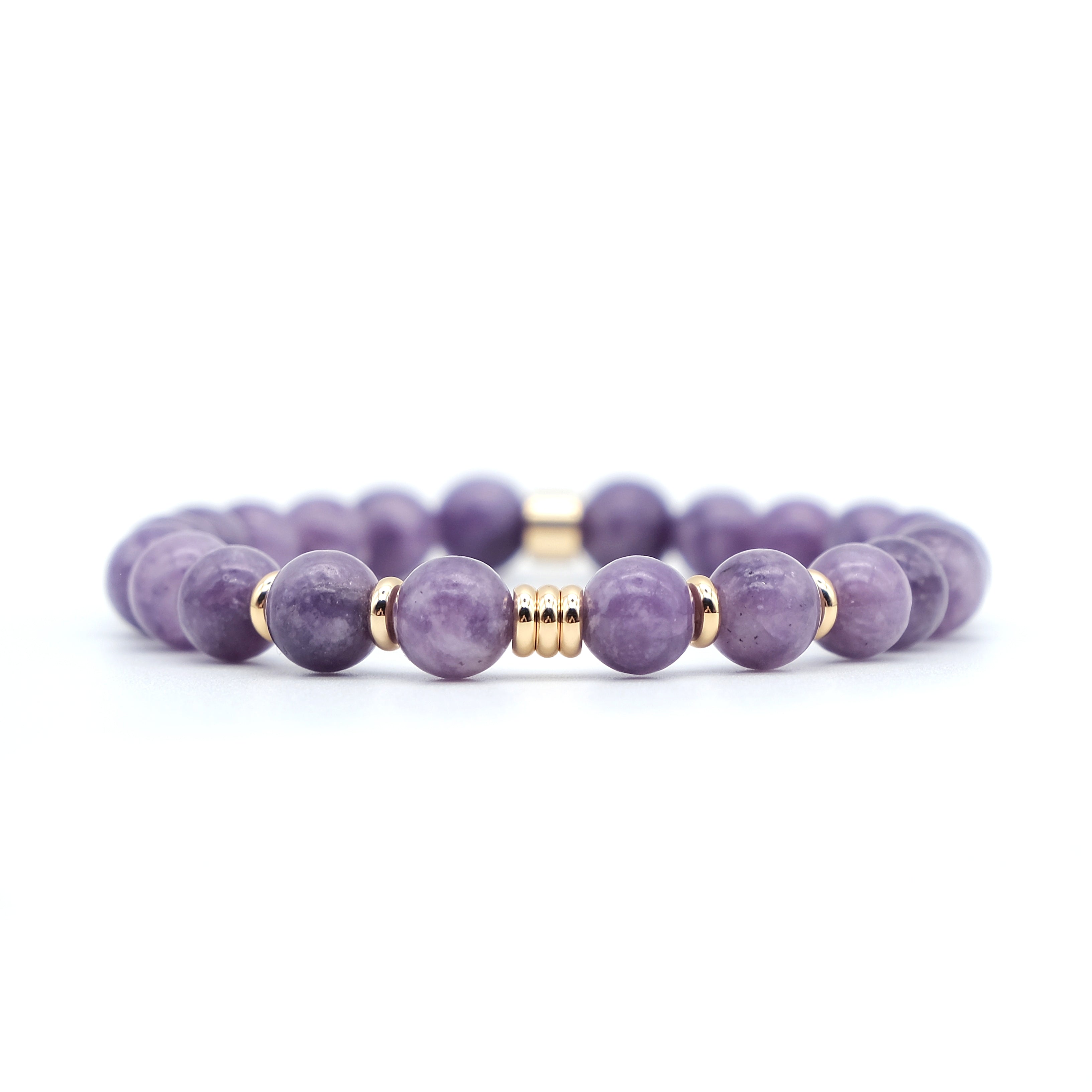 A lepidolite gemstone bracelet with gold accessories
