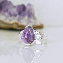 Amethyst teardrop gemstone ring in 925 sterling silver from a side angle