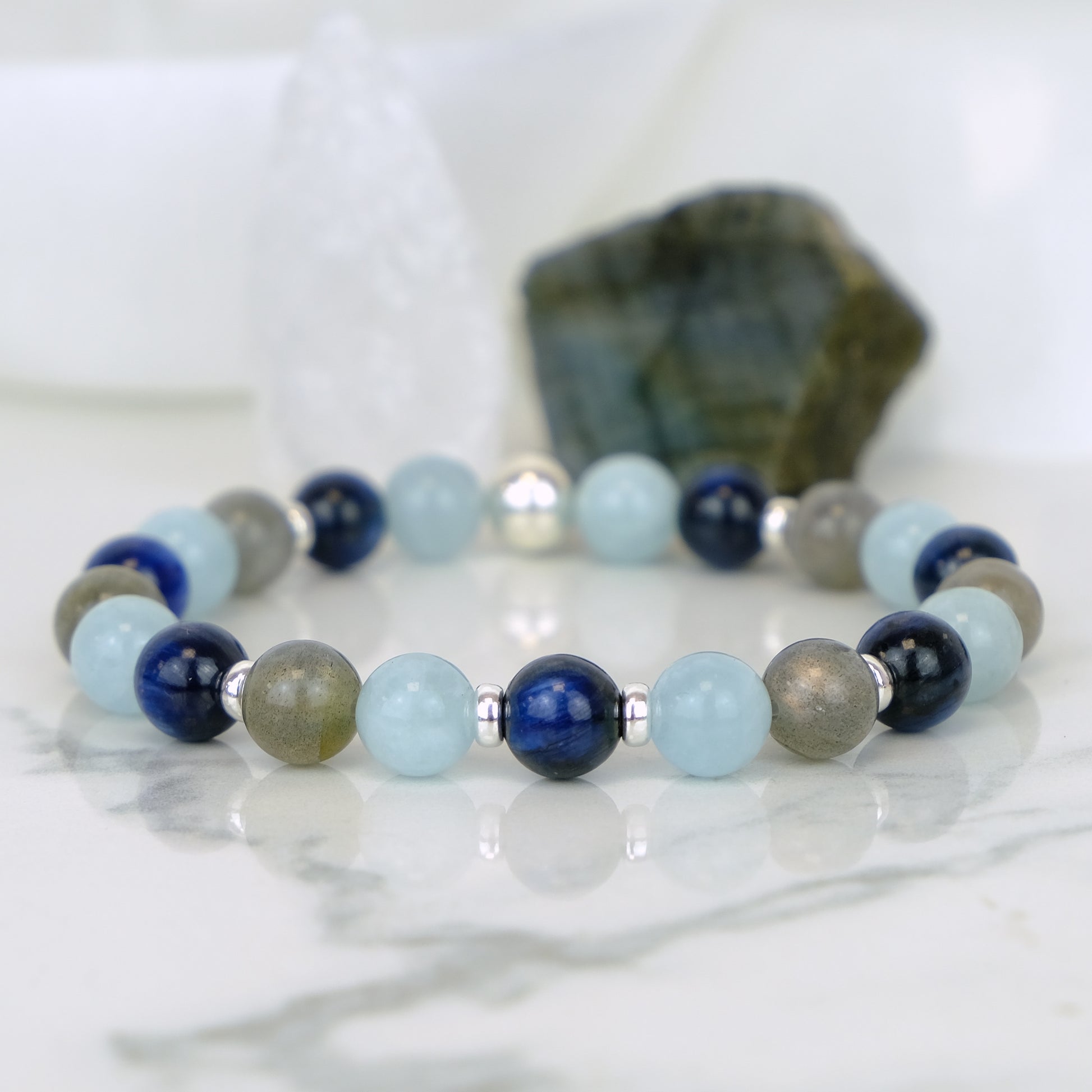 A Kyanite, Aquamarine and Labradorite gemstone bracelet with silver accessories 