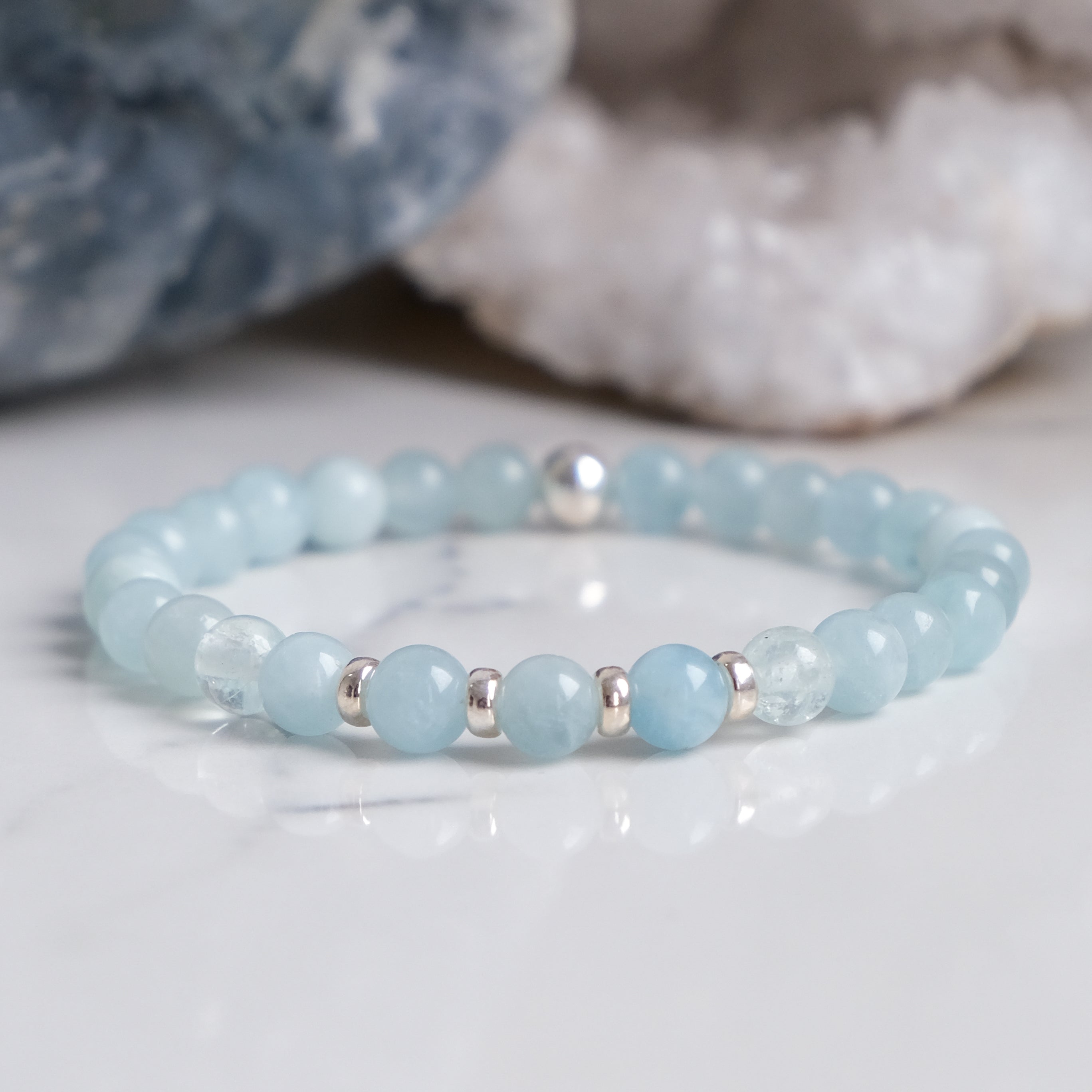 An Aquamarine gemstone bracelet in 6mm beads with 925 sterling silver accessories