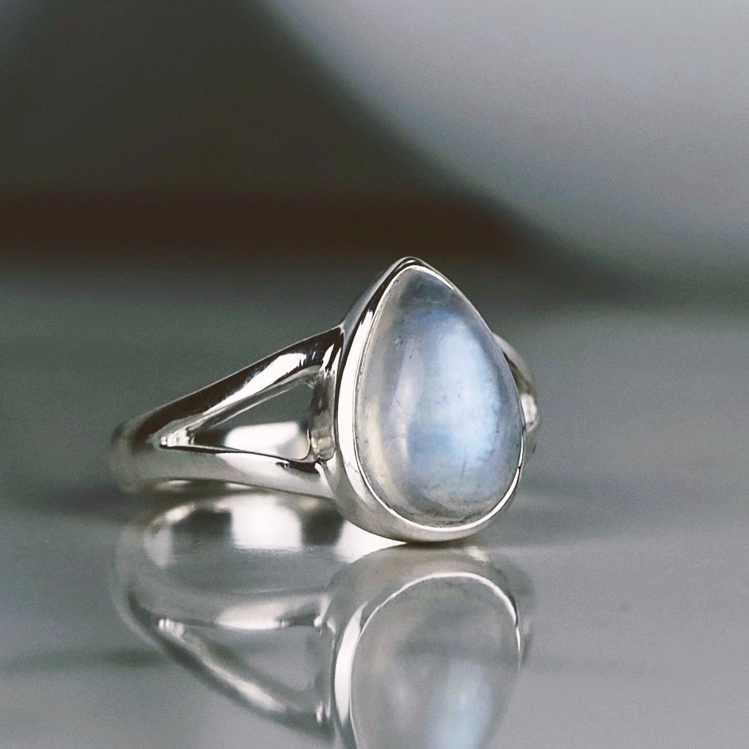 A rainbow moonstone teardrop ring from the side