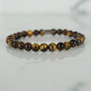 Tiger Eye energy gemstone bracelet with stainless steel accessories.