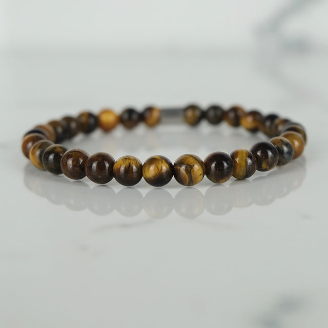 Tiger Eye energy gemstone bracelet with stainless steel accessories.