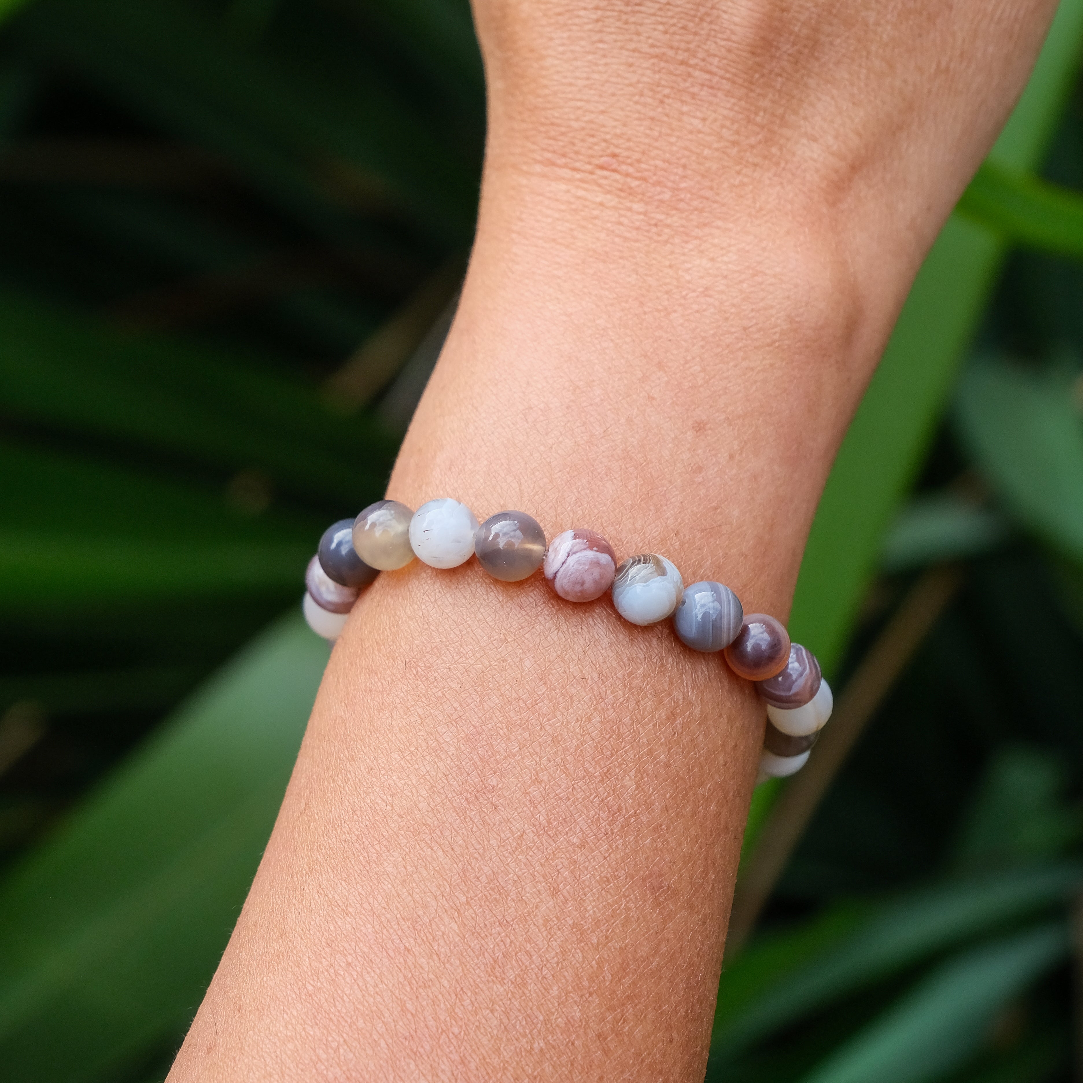 Botswana agate gemstone bracelet worn on a model's wrist