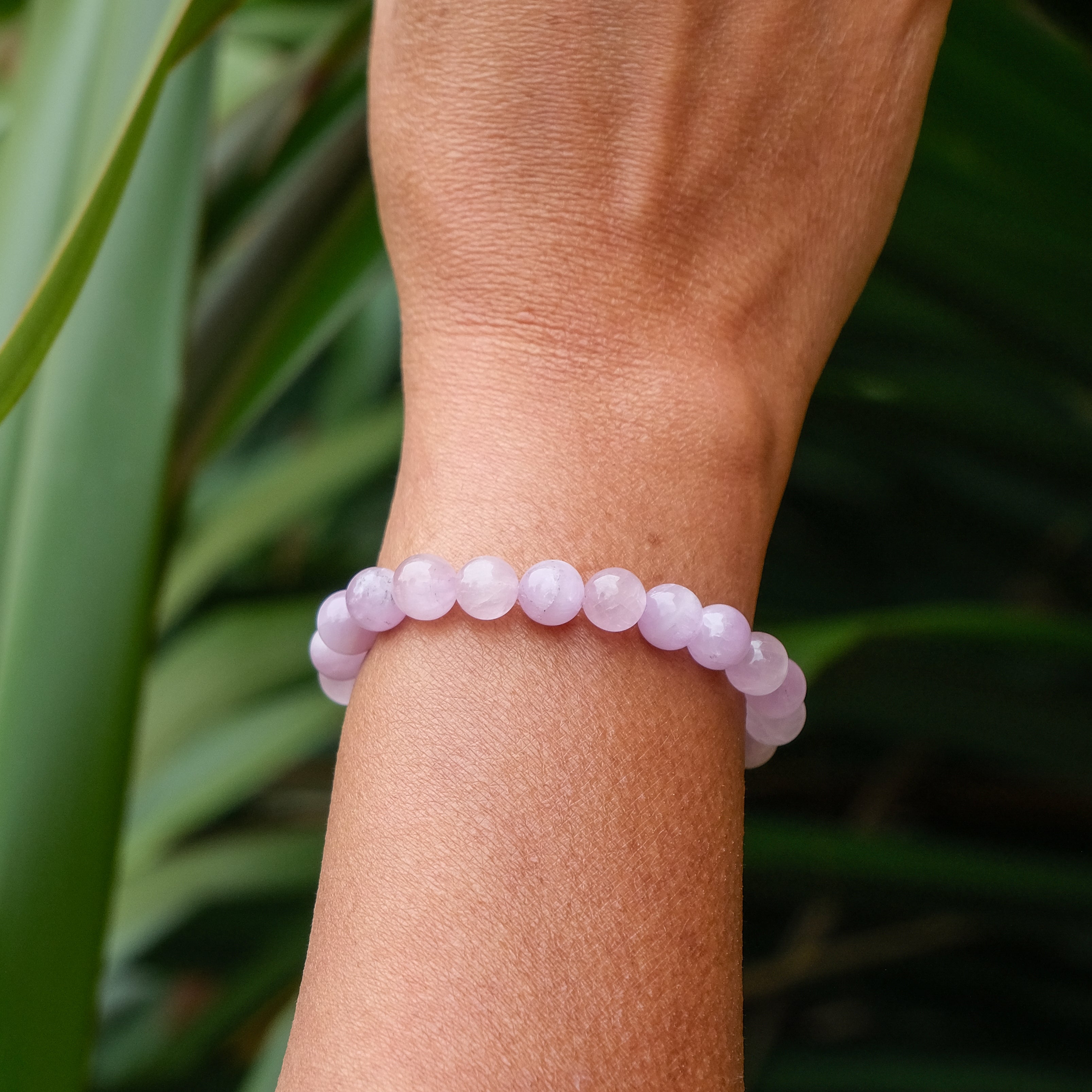 A Kunzite gemstone bracelet worn by a model