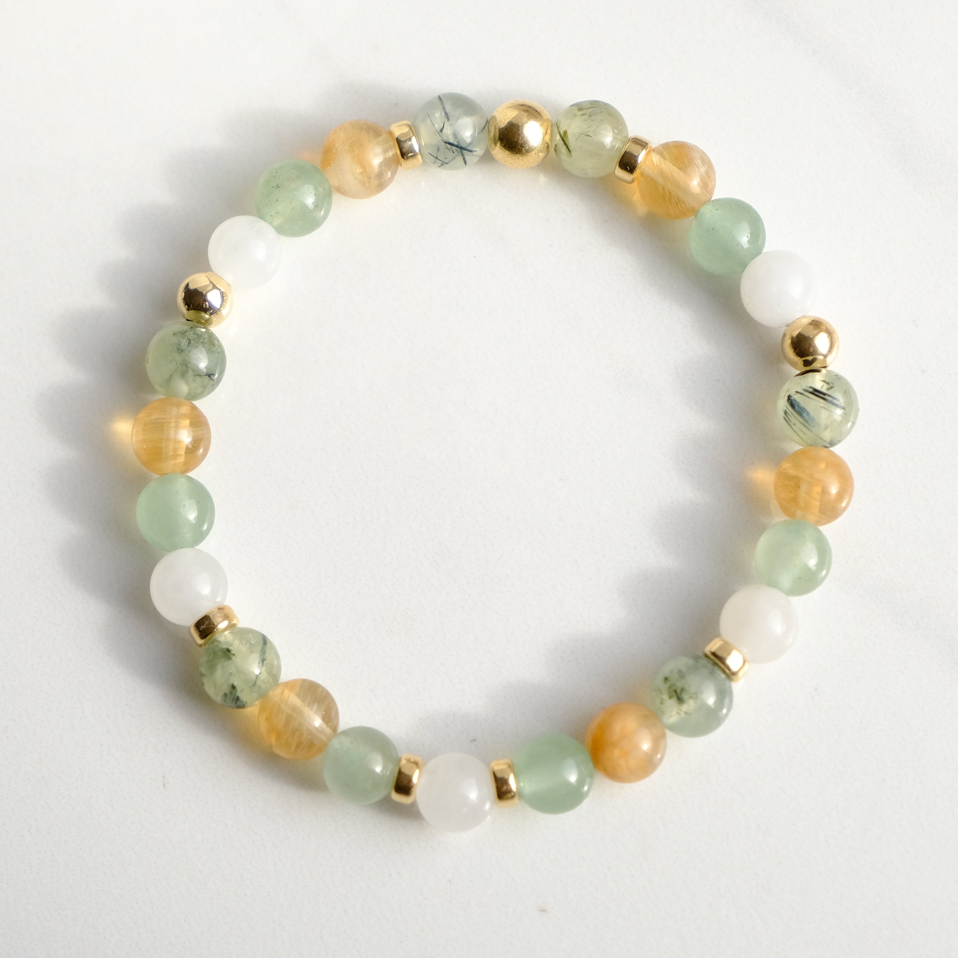 Renewal gemstone bracelet with gold accessories from above