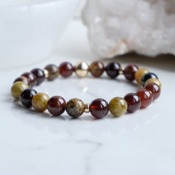 Garnet gemstone bracelet with gold accessories