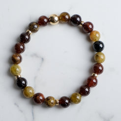 Garnet gemstone bracelet with gold accessories from above