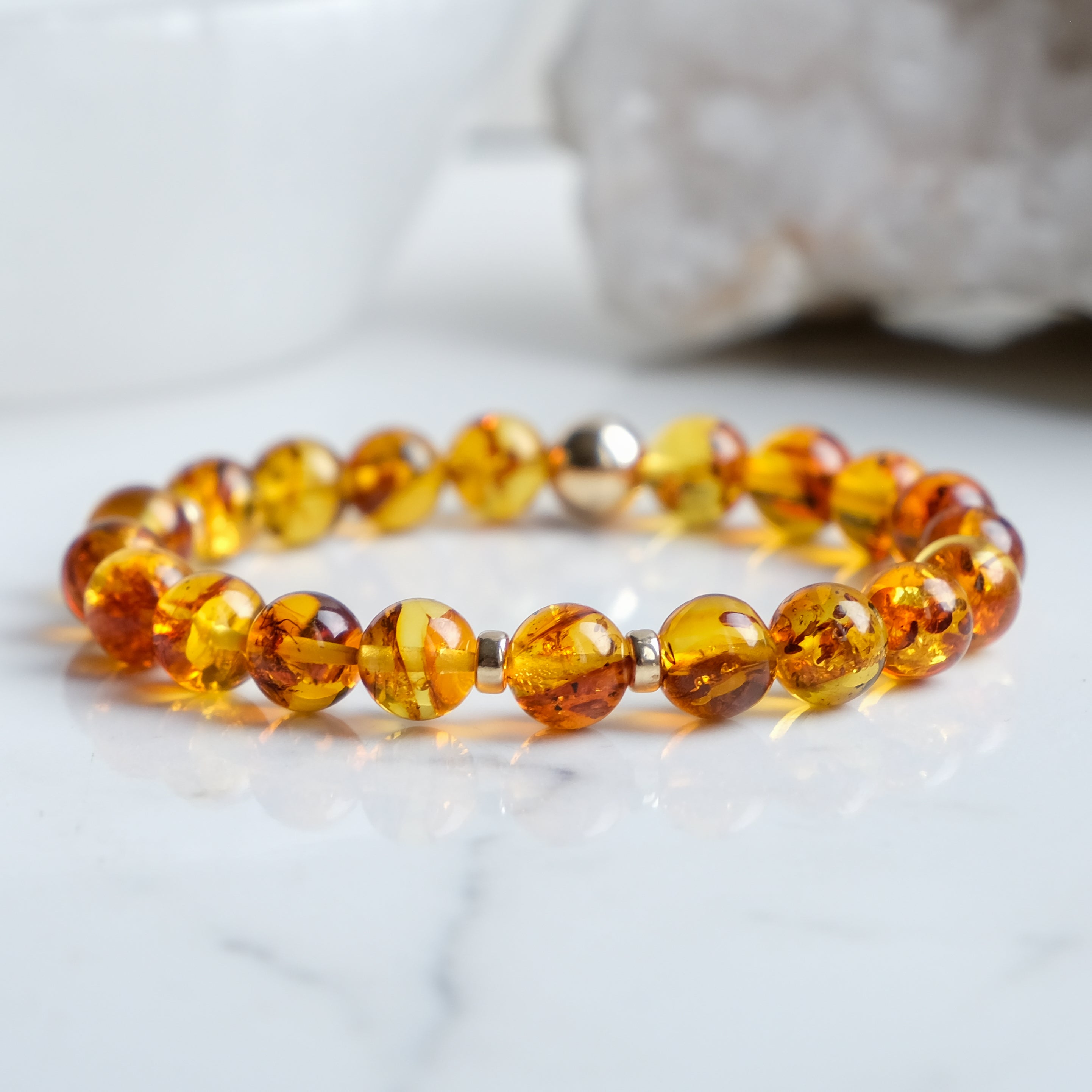 Amber beaded bracelet with gold accessories