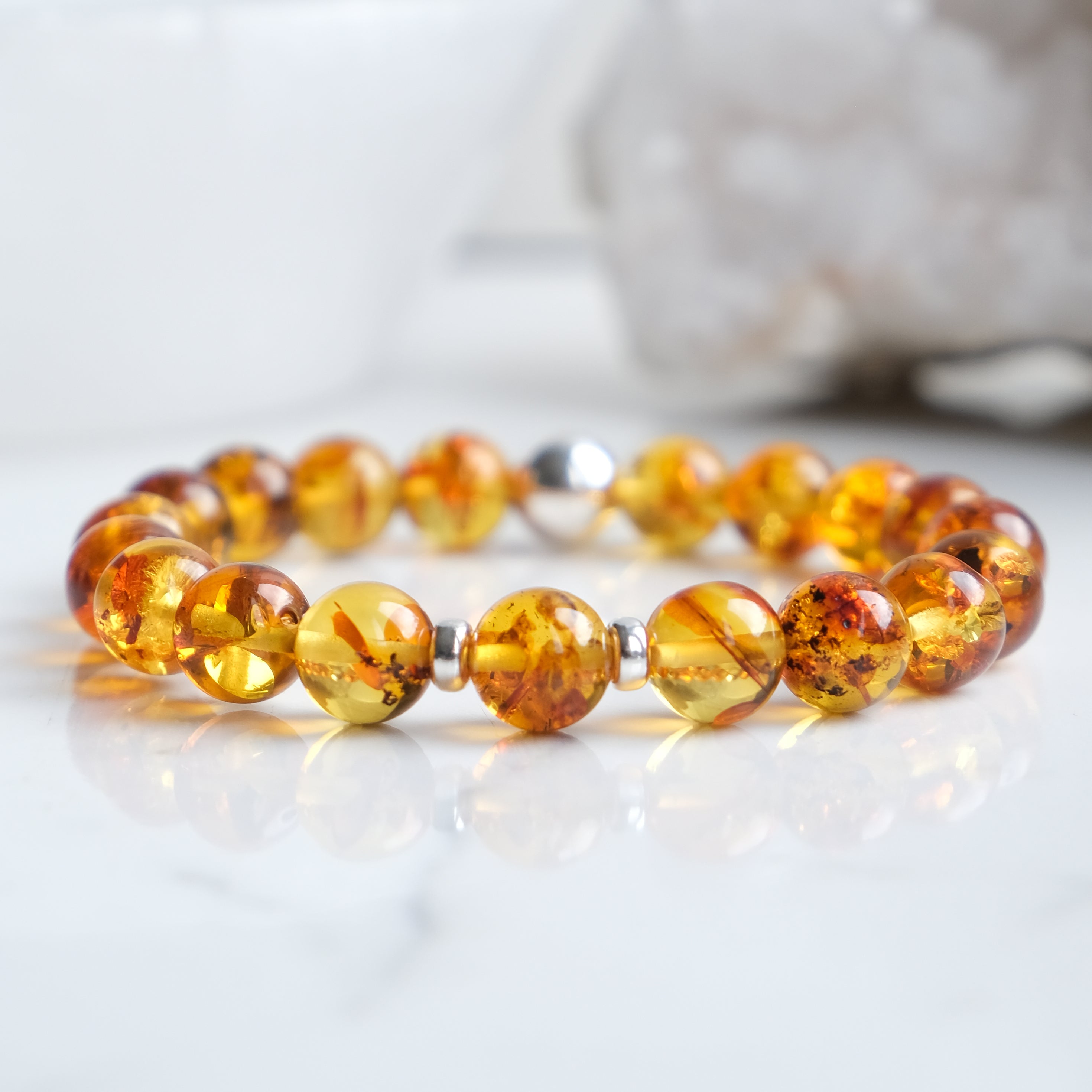 Amber beaded bracelet with silver accessories