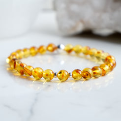 6mm Amber beaded bracelet with silver accessories