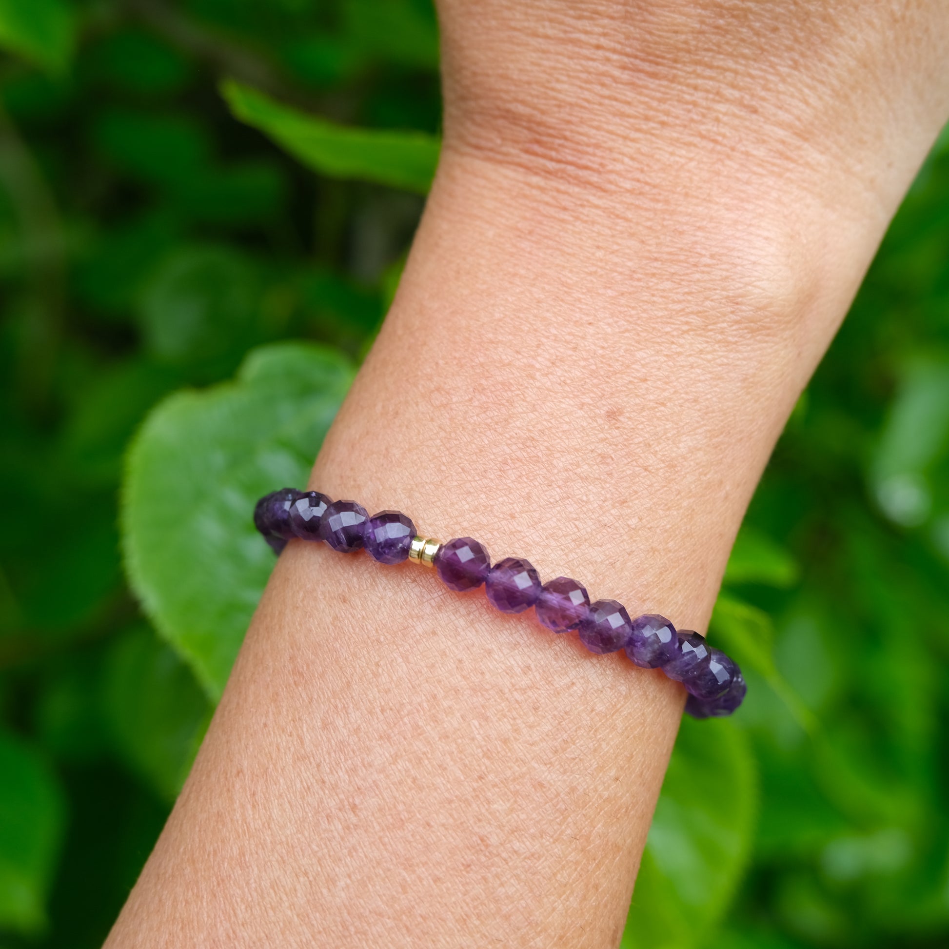 Amethyst faceted crystal bracelet worn on the wrist