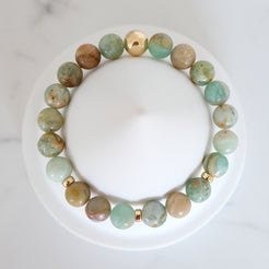 Green quartz gemstone bracelet with gold accessories from above