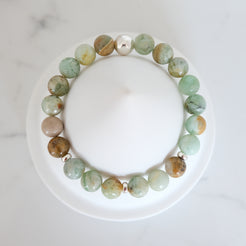 Green quartz gemstone bracelet with silver accessories from above