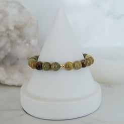Green garnet gemstone bracelet in 8mm with gold accessories