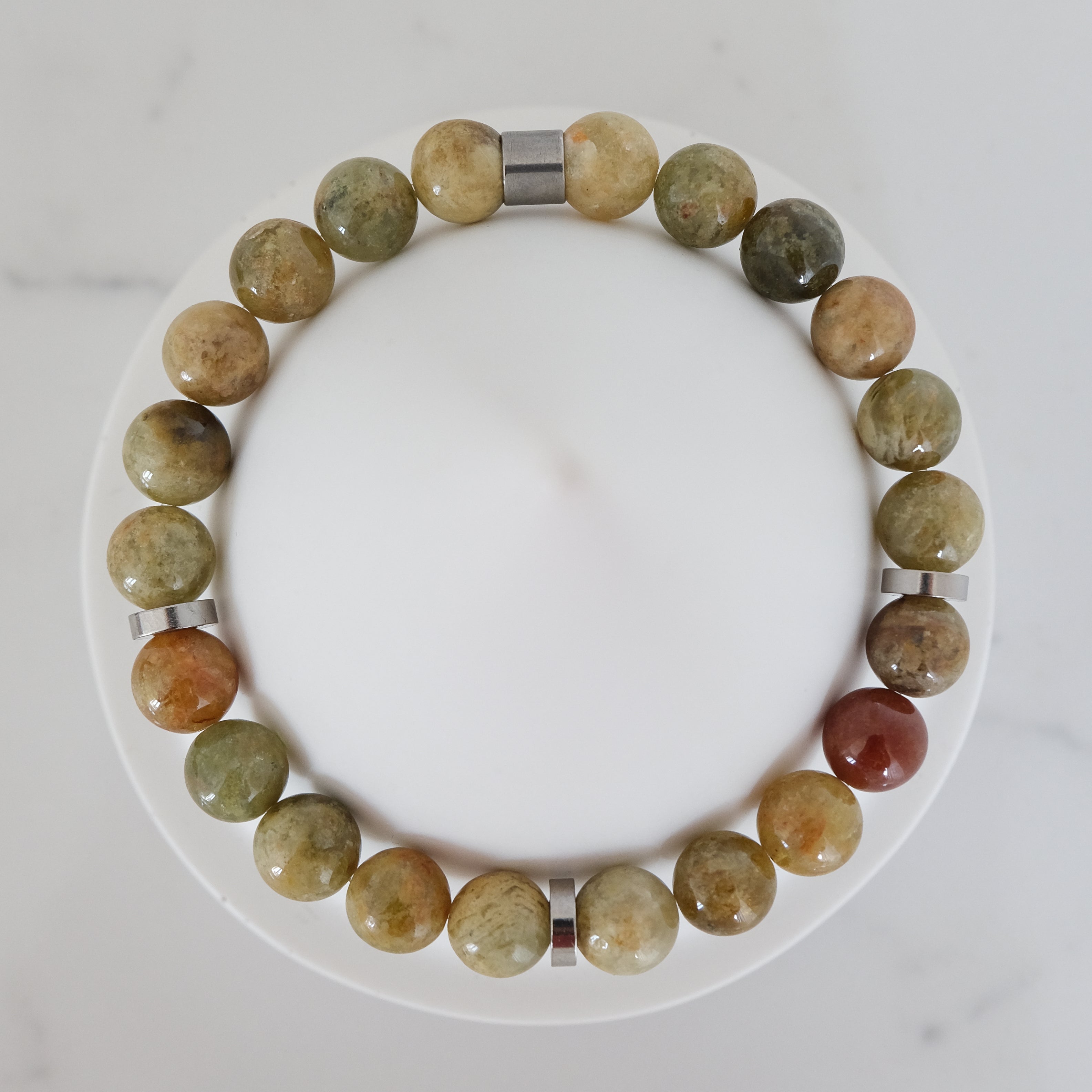 Green garnet gemstone bracelet in 8mm with steel accessories from above