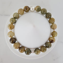 Green garnet gemstone bracelet in 8mm with silver accessories from above