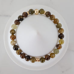 Green garnet gemstone bracelet in 6mm with gold accessories from above