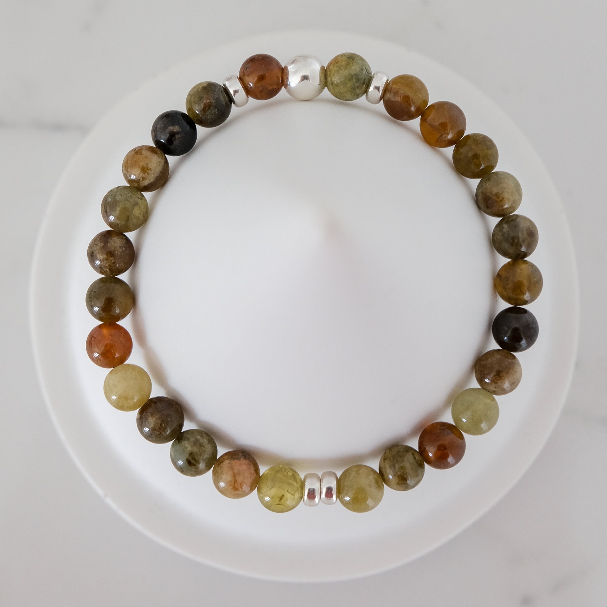 Green garnet gemstone bracelet in 6mm with silver accessories from above