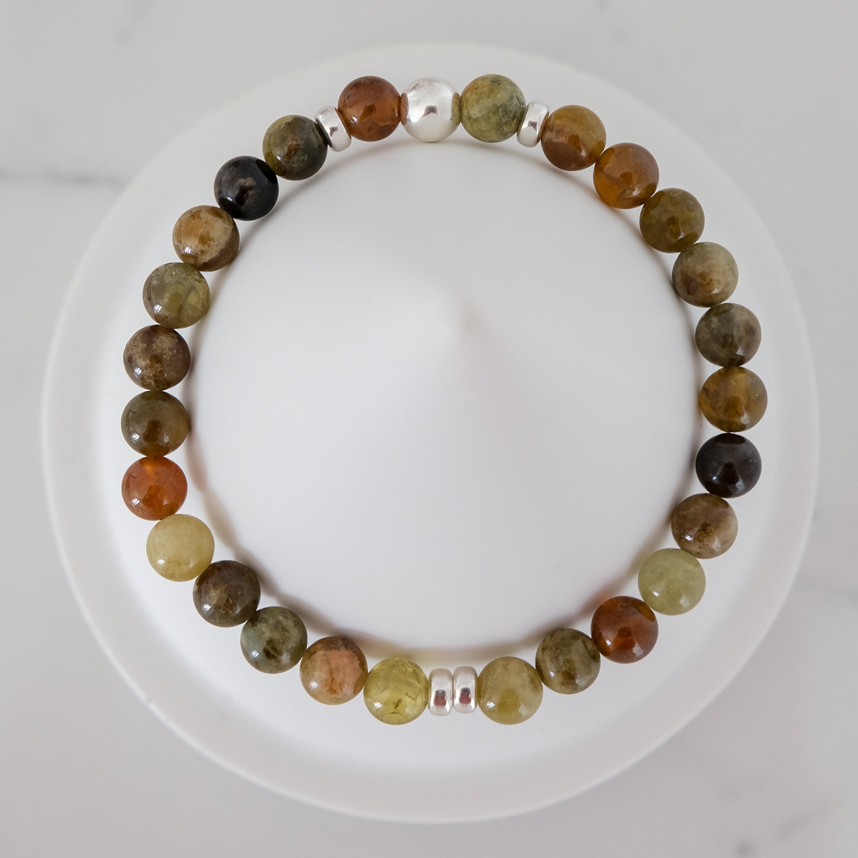 Green garnet gemstone bracelet in 6mm with silver accessories from above