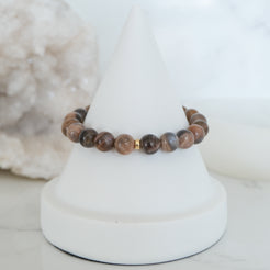 Black moonstone and sunstone gemstone bracelet with gold accessories