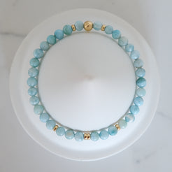 4mm larimar gemstone bracelet with gold accessories from above