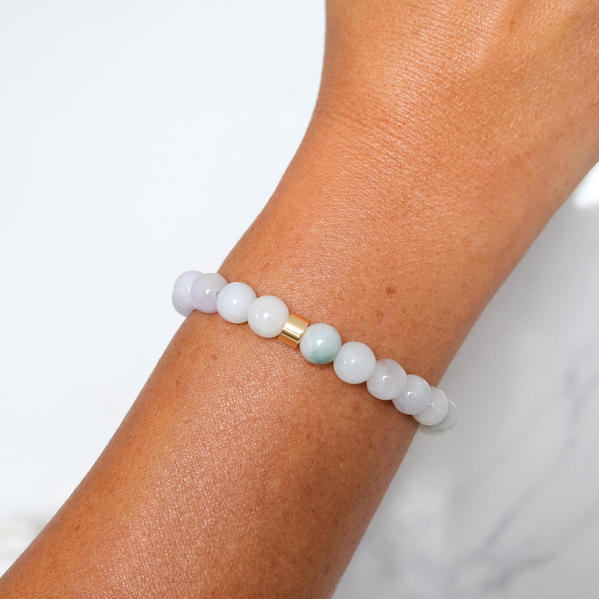 Light jade gemstone bracelet sample sale worn on a model's wrist