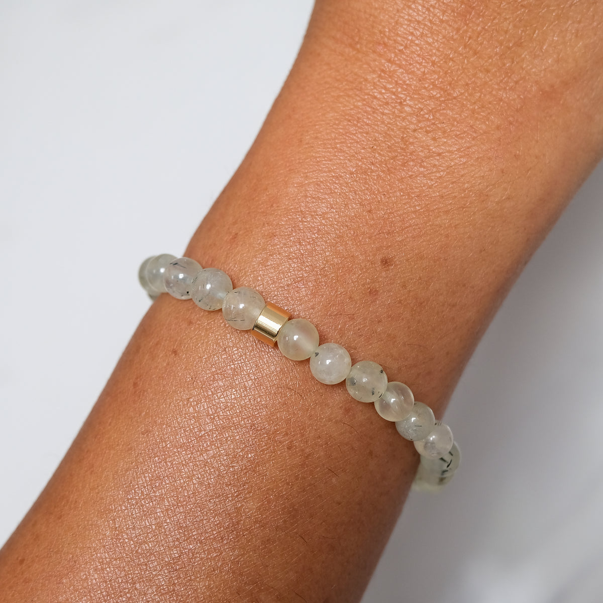 Prehnite sample sale bracelet worn on a model's wrist