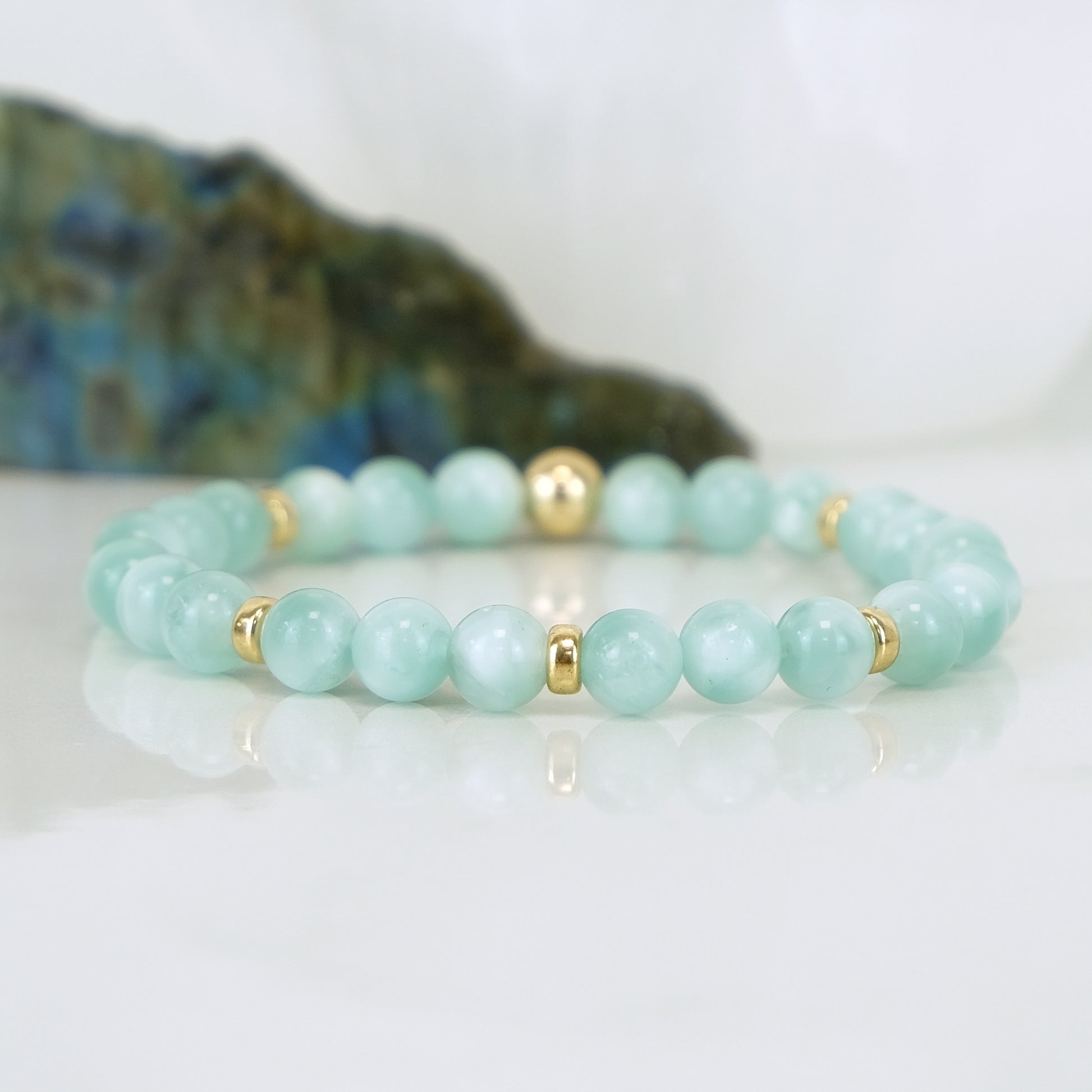 A green moonstone gemstone bracelet in 6mm with gold filled accessories
