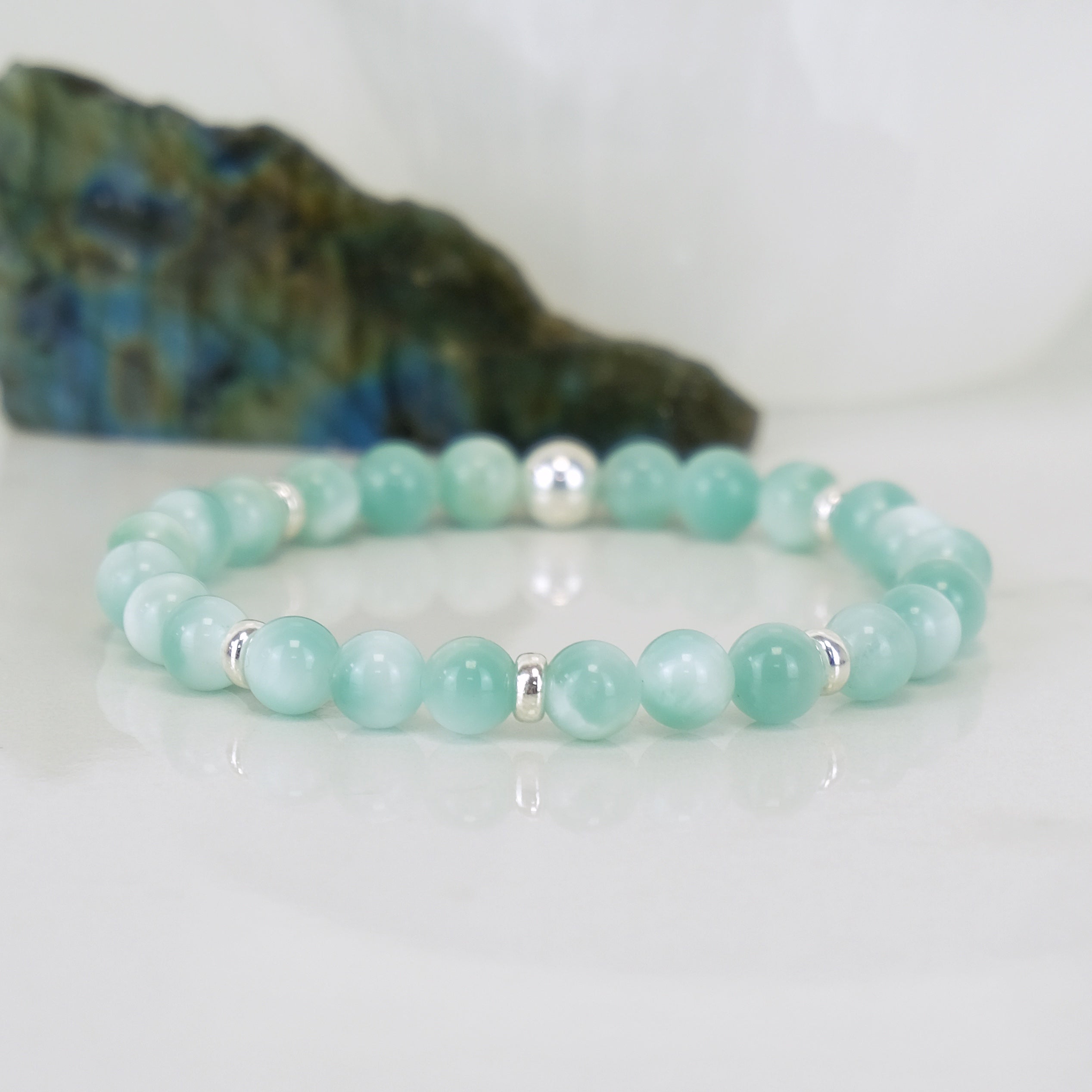A green moonstone gemstone bracelet in 6mm with 925 sterling silver accessories