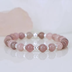 A lavender rose quartz gemstone bracelet in 6mm with 925 sterling silver accessories